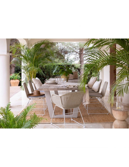 Chalk-colored synthetic rattan chair with white leg...