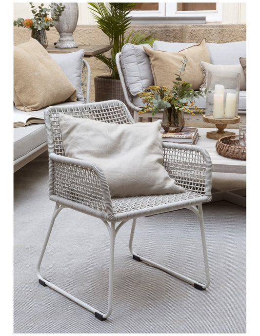 Grayish white rope and metal armchair