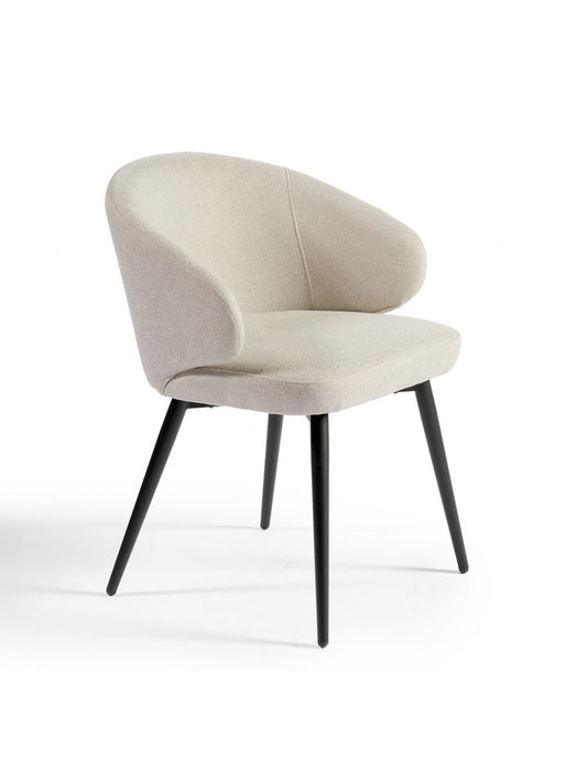 Sand-colored upholstered chair with black metal legs