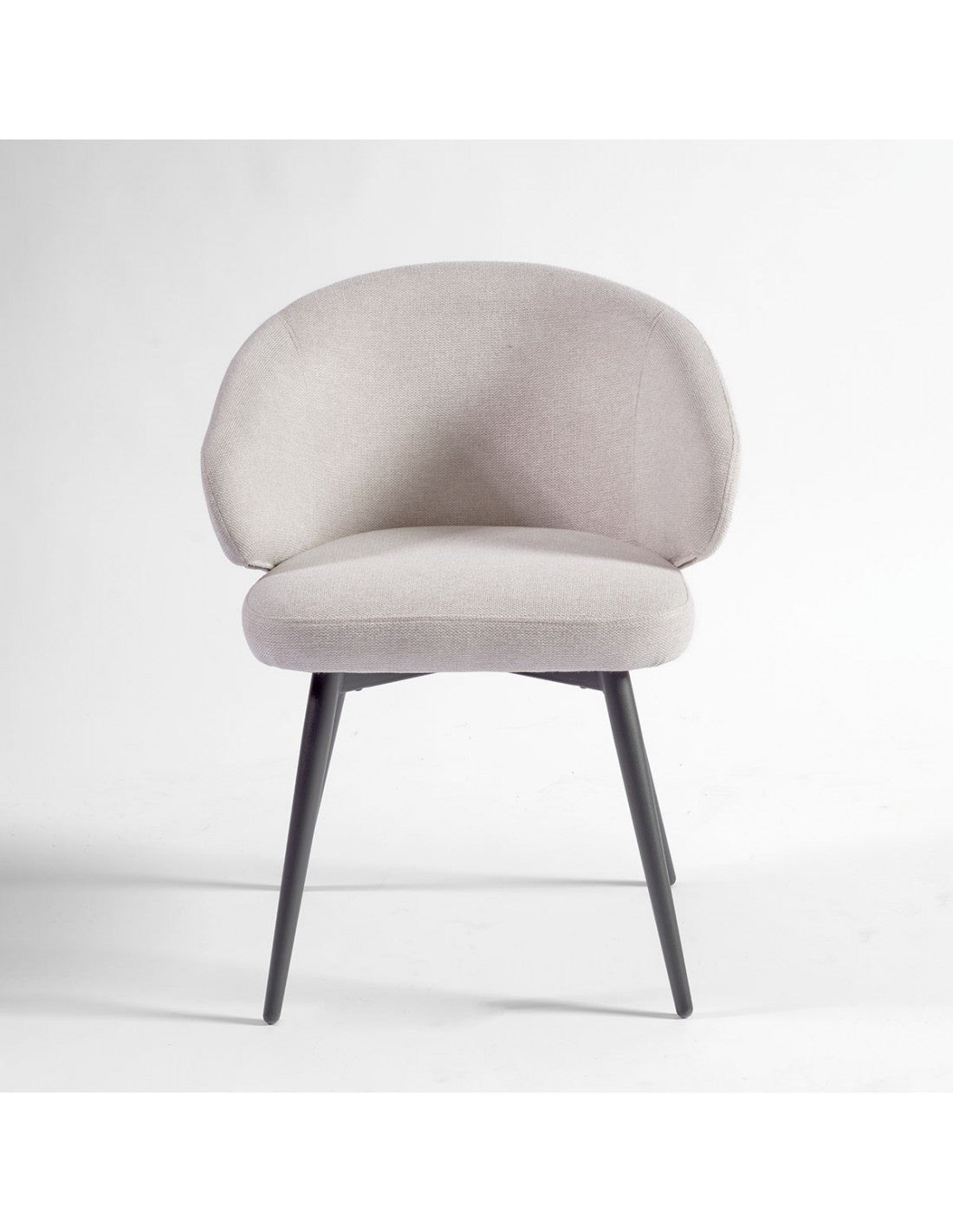 Sand-colored upholstered chair with black metal legs