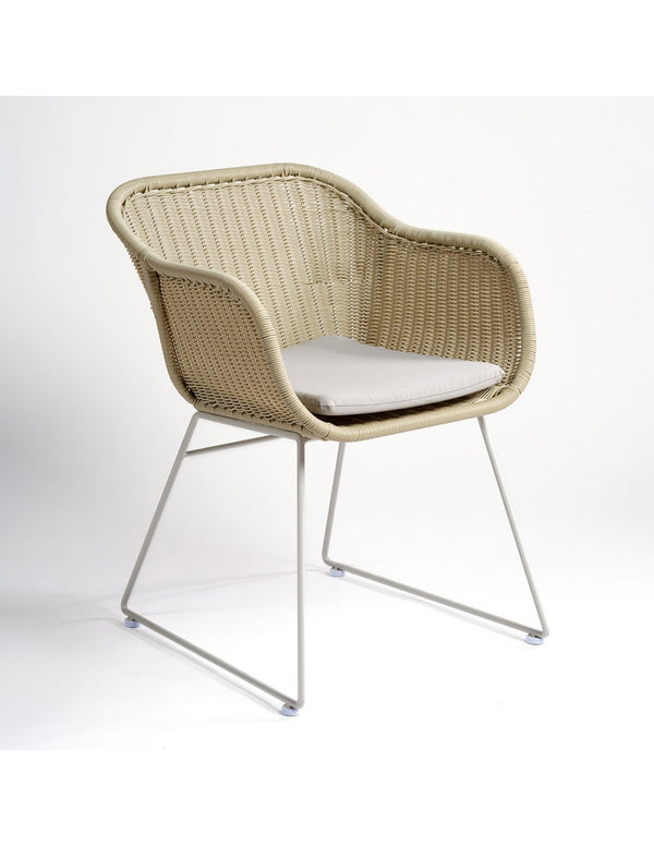 Chalk-colored synthetic rattan armchair...
