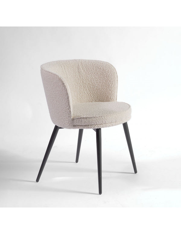 Rounded sand and black metal upholstered chair