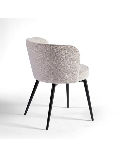 Rounded sand and black metal upholstered chair