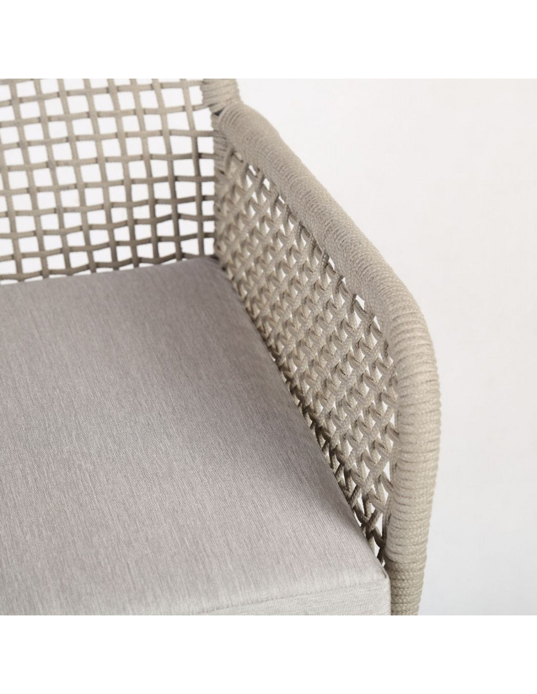 Grayish white rope and metal armchair