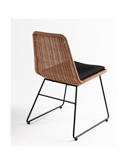 Synthetic rattan chair with black legs